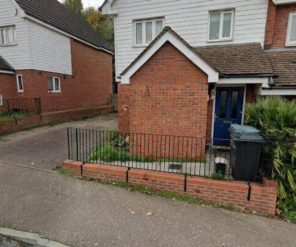 Two space drive alongside house